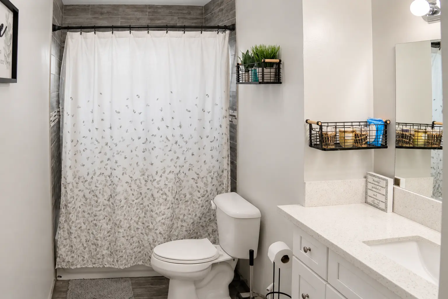 Full bathroom with tiled shower and vanity
