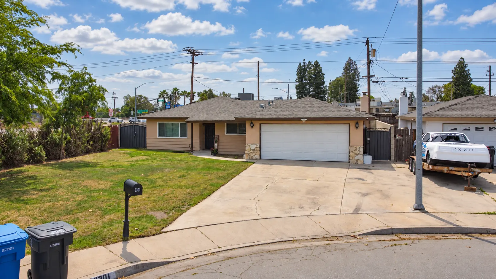 Listing exterior and street frontage at midday