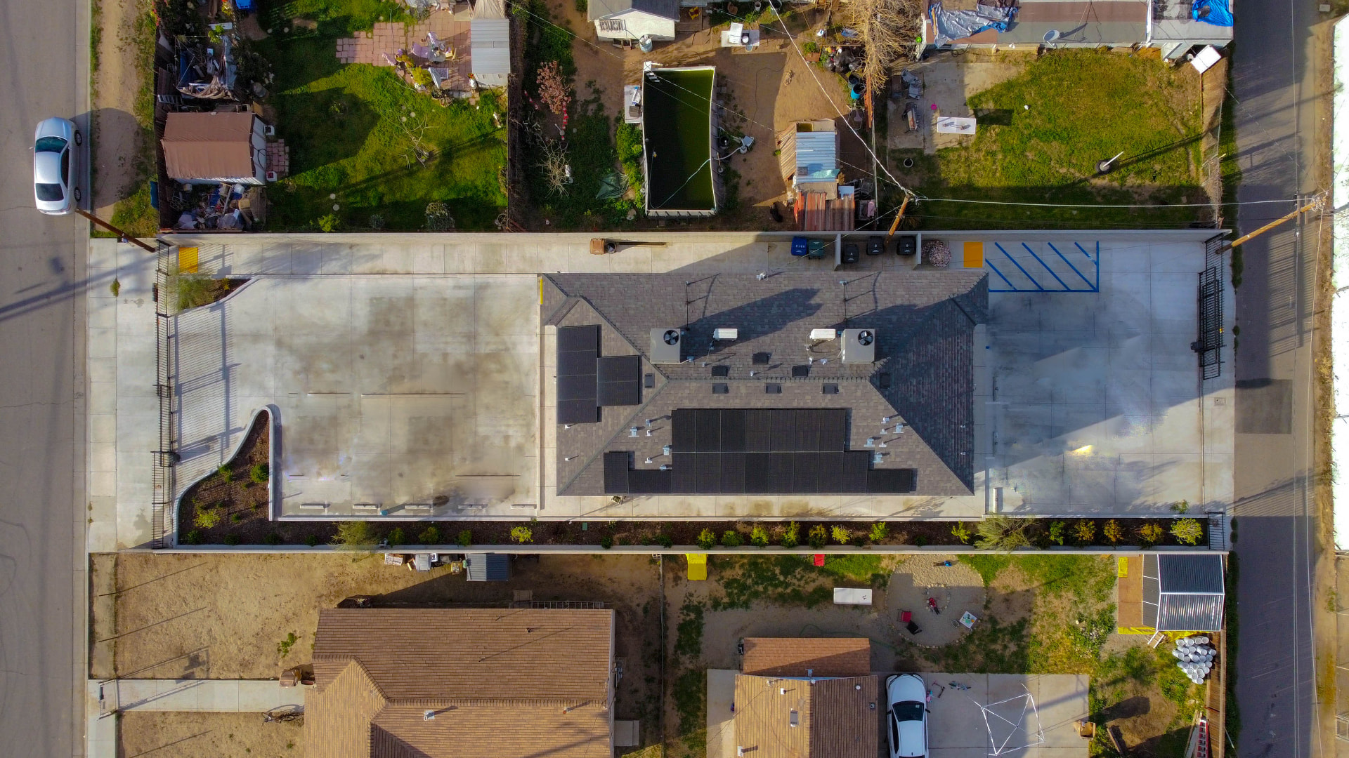 Direct top-down aerial of the full property and roofline